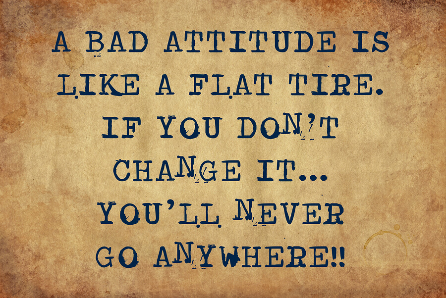 Inspiring motivation quote with typewriter text a bad attitude is like a flat tire. if you don't change it...you'll never get anywhere. Distressed Old Paper with Typing image.