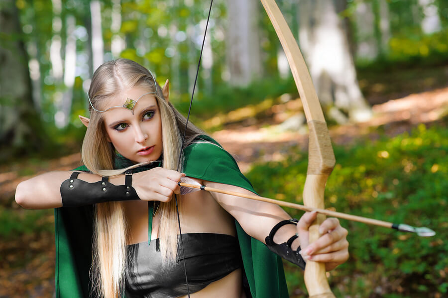 Picture of a woman with a felony shooting a bow and arrow.